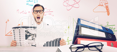 Composite image of geeky hipster reading the newspaper
