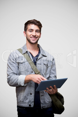 Composite image of student using tablet in library