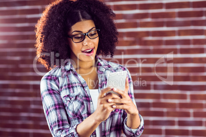 Surprised attractive hipster texting