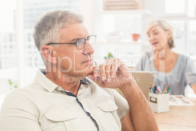 Thoughtful businessman working at office