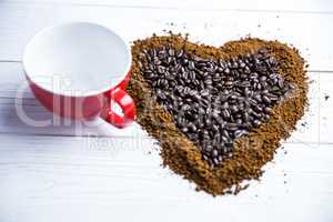 Coffee on a table in heart shape with cup