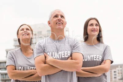 Smiling volunteers looking up