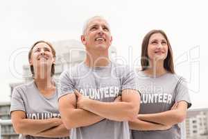 Smiling volunteers looking up