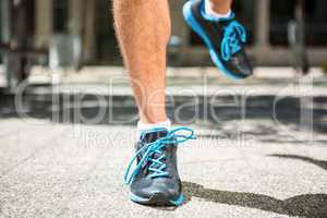 Close up view of athletes feet jogging