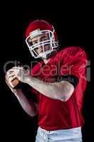 Portrait of american football player being about to throw footba