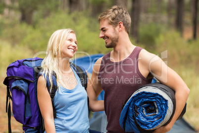 Young happy joggers looking at each other