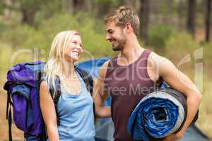 Young happy joggers looking at each other