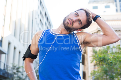 Handsome athlete stretching his head