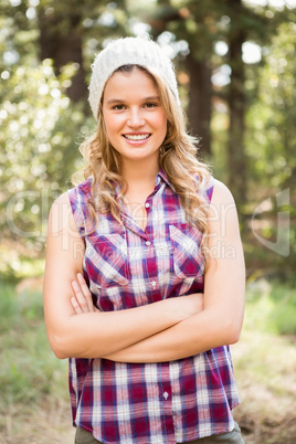 Pretty young blonde smiling with arms crossed Pretty young blonde smiling with arms crossed