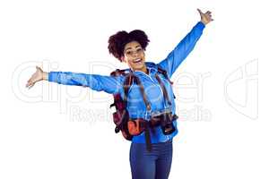 Ecstatic young woman with arms in the air