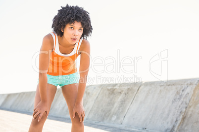 Breathing young sporty woman resting