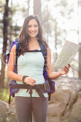 Young happy jogger looking at camera