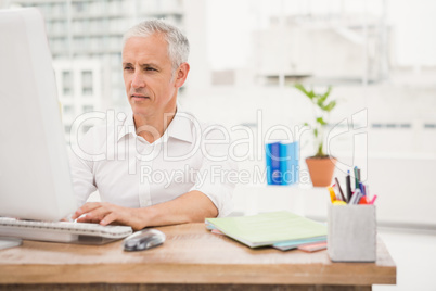 Casual businessman working with computer
