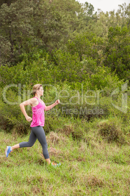 Pretty blonde athlete jogging