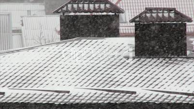 Snowfall on roofs
