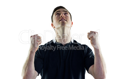 Excited rugby player gesturing victory