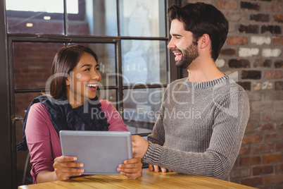 couple looking at the tablet