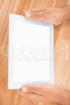 Hands holding blank screen tablet Hands holding blank screen tablet