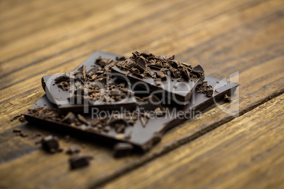 Pieces of chocolate on a wooden table