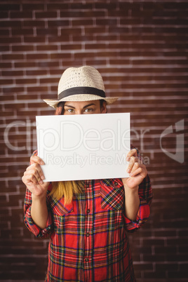 Beautiful hipster showing white card