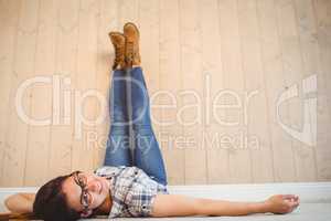 Pretty hipster with legs on wall