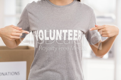 Female volunteer showing her shirt