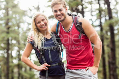 Happy young couple looking at camera