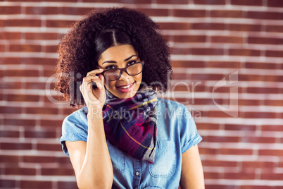 Smiling attractive hipster posing with glasses