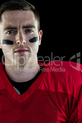 Smiling american football player looking at camera Smiling american football player looking at camera