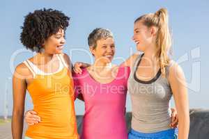 Sporty women smiling at each other
