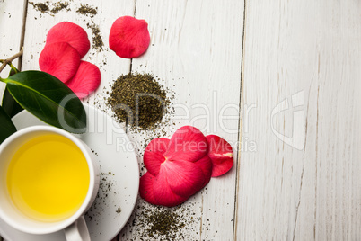 Cup of herbal tea on table