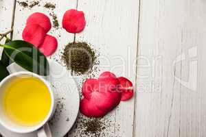 Cup of herbal tea on table