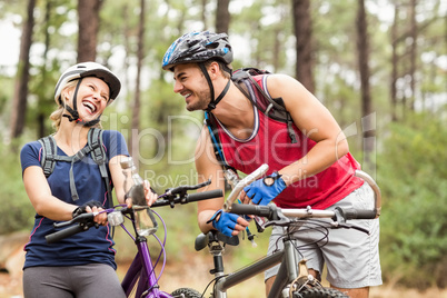 Happy handsome biker couple laughing