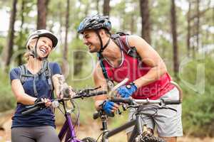 Happy handsome biker couple laughing