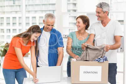 Casual business people sorting donations