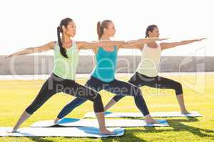 Sporty women stretching on exercise mat