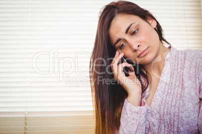 Pretty brunette on a call