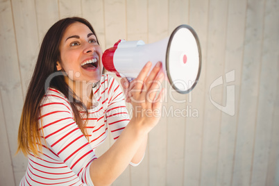 Pretty hipster shouting through megaphone