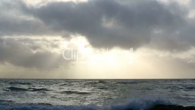 Waves of the Atlantic Ocean with dark clouds