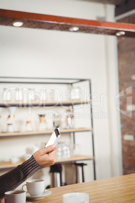 A man holding his smartphone