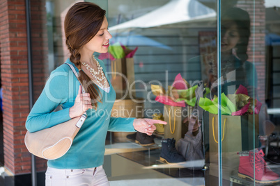 Woman looking at shop window