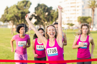 Cheering blonde winning breast cancer marathon