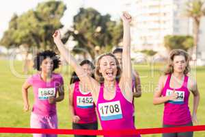 Cheering blonde winning breast cancer marathon