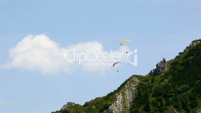 Paragliders flying over Bavarian mountains