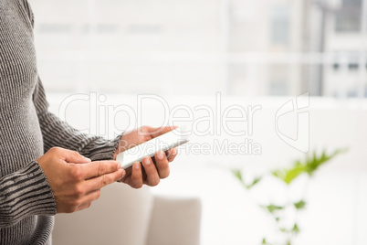 Close up view of hands using smartphone