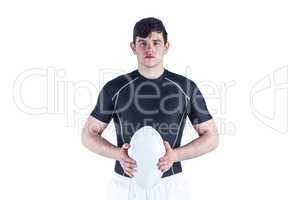 Rugby player holding a rugby ball