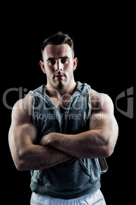 Handsome bodybuilder with arms crossed