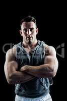 Handsome bodybuilder with arms crossed