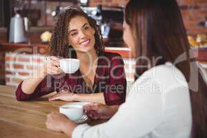 Female friends having coffee