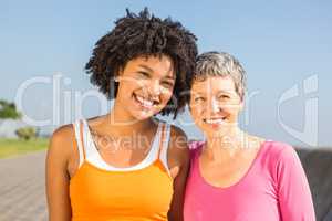 Two sporty women smiling at camera